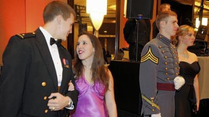 During the Grand March, Navy Midshipman Michael Dominik, left, and Jackie Wilburn, and Army Cadet William A. Mengon and Christin Folwarczny.
