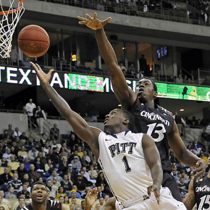Tray Woodall drives to the basket against Cincinnati's Cheikh Mbodj in the first half Monday at Petersen Events Center. Woodall scored nine points, but only two after halftime as Pitt's offense bogged down.