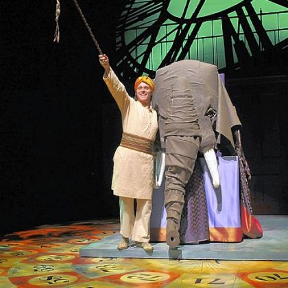 Richard B. Watson portrayed the elephant driver in "Around the World in 80 Days" at Pittsburgh Public Theater, where Michael Schweikardt's board-game floor made for great scenic design.