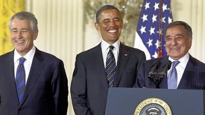 President Barack Obama and his choice for Defense Secretary, former Nebraska Sen. Chuck Hagel, left, laugh as current Defense Secretary Leon Panetta speaks in the East Room of the White House.