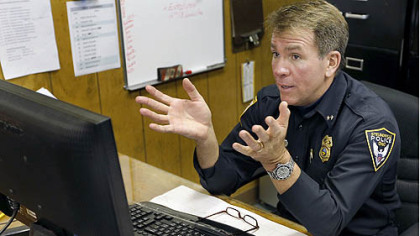 Steubenville police Chief William McCafferty sits behind a computer as he discusses an email he had opened earlier that disabled his PC.