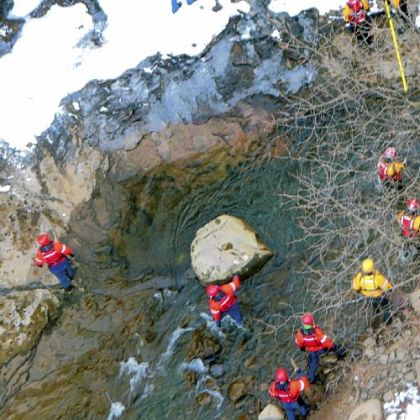 Searchers comb along the Youghiogheny River on Saturday below the former Western Maryland Railroad bridge at Ohiopyle for traces of Jeremy Walker, 29, of Somerset.
