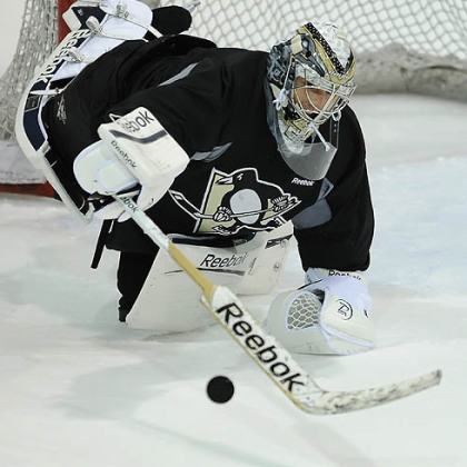 Penguins goalie Marc-Andre Fleury makes a save during afternoon workouts at Southpointe.

