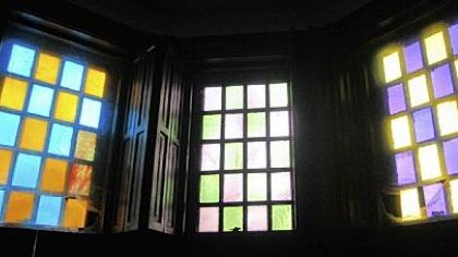 Stained glass in the upper windows of the den.

