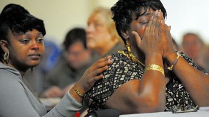 Ka'Sandra Wade's friend Sheena Davis, left, of Wilkinsburg comforts Ms. Wade's mother, Sharon Jordan, of Aliquippa during a vigil for Ms. Wade at Eastminster Presbyterian Church in East Liberty on Saturday.
