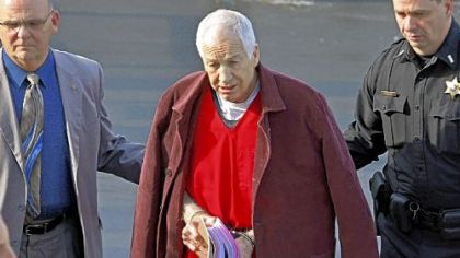 Former Penn State University assistant football coach Jerry Sandusky, center, leaves the Centre County Courthouse after attending a post-sentence motion hearing Thursday in Bellefonte, Pa.


