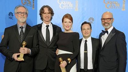 "Game Change" producer Gary Goetzman, left, director Jay Roach, actress Julianne Moore, writer Danny Strong and producer Steve Shareshian celebrate Golden Globe wins for best miniseries or motion picture made for television and best actress, miniseries or TV movie for Ms. Moore. Ed Harris also won for supporting actor, miniseries or TV movie.
