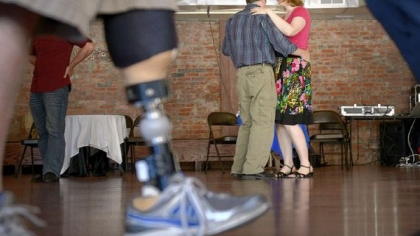 Krista and Cleve Cooke of Morningside dance during a "Salsa for Soldiers" fundraiser at Pittsburgh Dance Studio in Bloomfield.