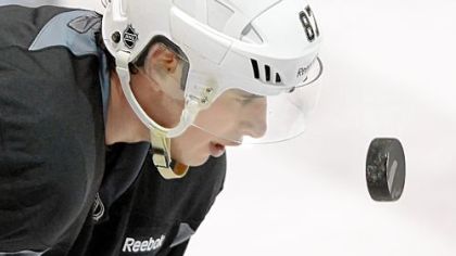 Sidney Crosby eyes up the puck during workouts Monday at Southpointe.


