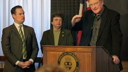Scott Kunka, the city's finance director (right), along with Mayor Luke Ravenstahl and city council President Darlene Harris, details the mayor's proposed reduced tax millage rate and other tax reductions on Monday.
