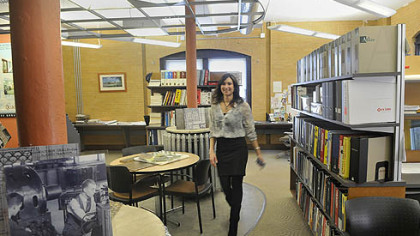 Jennifer McDowell, who works for the Quad3 Group, walks through the firm's office in Lawrenceville.