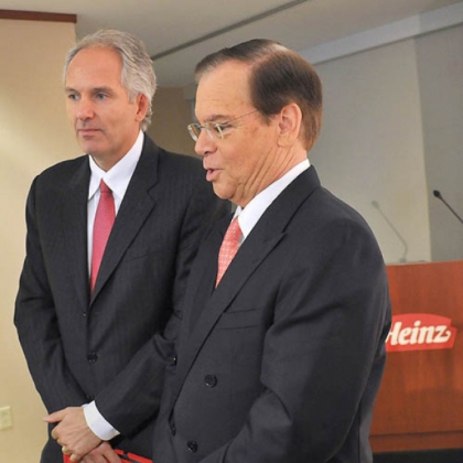 Following  a press conference held today to announce that H. J. Heinz Company is to be acquired by Berkshire Hathaway and 3G Capital, Alex Behring, left, managing partner at 3G Capital,  answers a few last questions from reporters along with William R. Johnson, chairman, president and CEO of Heinz.