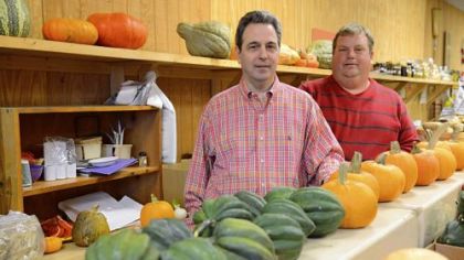 Vendors and friends David Lagnese, left, and Bryan Greenawalt at the Farmers' Market Cooperative of East Liberty.

