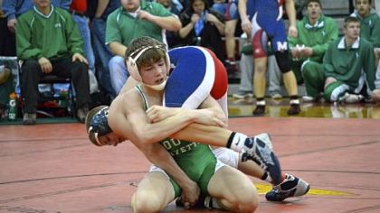 South Fayette's Mike Carr has Shaler's Logan Heinl draped over his shoulder during consolation match in 120-pound weight class at the Allegheny County Tournament.
