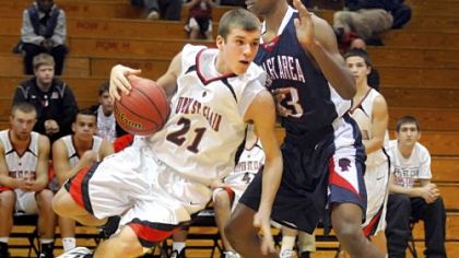 Upper St. Clair's Jason Grabowski went airborne to try to get around Shaler's Geno Thorpe during a game last season.
