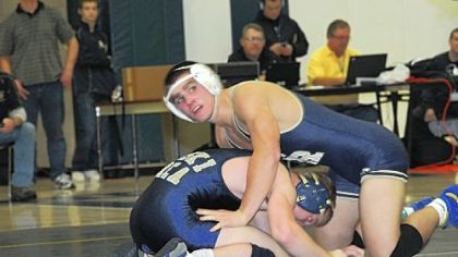Franklin Regional's Josh Shields (top) defeated Kiski Area's Cole Lewandowski, 7-2, in the 145-pound championship match at the Westmoreland County Coaches Association Tournament Saturday at Franklin Regional High School.