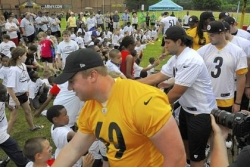 Rookies savor day at Tomlin's football camp for kids