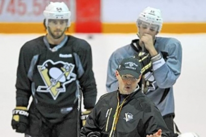 Penguins coach Dan Bylsma gets down to business in drills on the first day of Penguins camp Sunday.