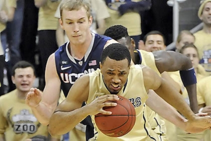 Pitt's Trey Zeigler takes a foul from Connecticut's Niels Giffey in the first half of this afternoon's game at Petersen Events Center.
