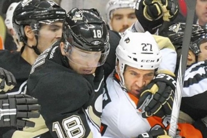The Penguins open the NHL season in Philadelphia today at 3:08 p.m.  Above, Penguins left winger James Neal wraps up Flyers center Maxime Talbot in a 2011 game at Consol Energy Center.