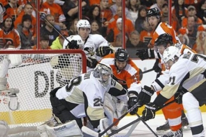 Goalie Marc-Andre Fleury withstands a Flyers rush in the first period, denying Max Talbot for one of his 26 saves in the Penguins' season-opening win at Wells Fargo Center in Philadelphia -- the place where the Penguins' 2011-12 season ended in April.