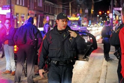 In an effort to add a more significant presence to the South Side, the police and fire departments were dispatched to the South Side starting this weekend. Here, a police officer talks to the passenger of a limousine that police had randomly stopped on East Carson Street at 15th Street to search for illegal drugs and alcohol violations. Firefighters also were going into bars and businesses along Carson looking for various code violations.