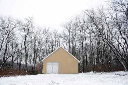 The 11-acre property also includes a riding trail and a four-stall barn, rebuilt four years ago and painted to match the main house.