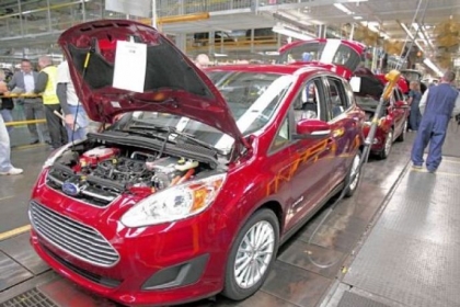 Ford workers assemble a C-MAX hybrid at the Michigan Assembly Plant in Wayne. The plant is the only one in the world that builds vehicles with five different fuel efficient powertrains on the same line.