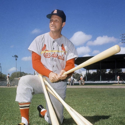 In this March 23, 1964 photo, Stan Musial visits his former teammates at the St. Louis Cardinals spring training baseball camp in Florida.