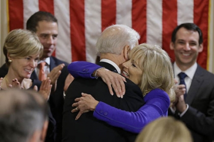 Vice President Joe Biden hugs his wife Jill Biden after taking the oath of office during and official ceremony at the Naval Observatory.