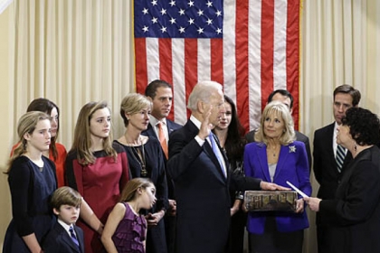 Vice President Joe Biden, with his wife Jill Biden holding the Biden family Bible, takes the oath of office from Supreme Court Justice Sonia Sotomayor during an official ceremony at the Naval Observatory.