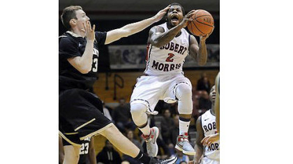 Robert Morris' Velton Jones drives to the net against Bryant's Joe O'Shea in the first half Thursday night.