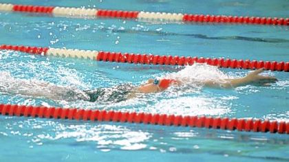 Moon Area High School senior Alexis Mitcheltree swims backstroke last Thursday.