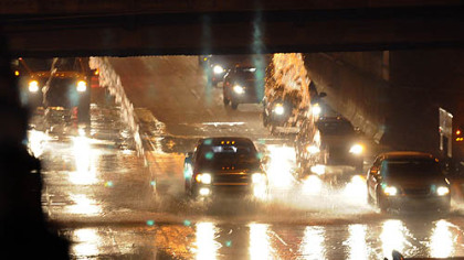 Water from a break on Fort Pitt Boulevard cascades into the "bathtub" section of the westbound Parkway East early Thursday morning.