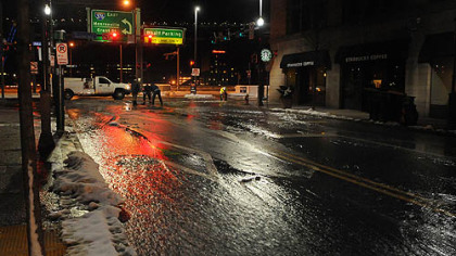 Water runs along Wood Street from the early morning break.