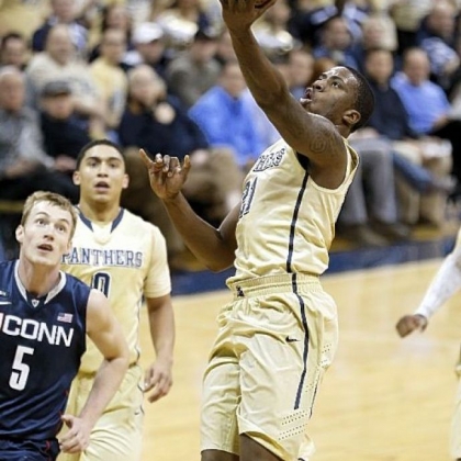 Pitt's Lamar Patterson shoots in front of Connecticut's Niels Giffey in the first half of the Panthers' 69-61 win Saturday.