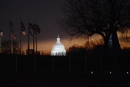 Dawn breaks in Washington, D.C., and illuminates the Capitol dome on inauguration day for Barack Obama's second term.
