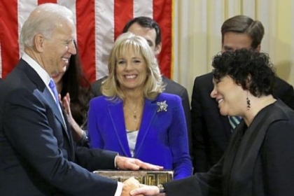 Vice President Joe Biden, with his wife, Jill Biden, center, holding the Biden family Bible, shakes hands Sunday with Supreme Court Justice Sonia Sotomayor after taking the oath of office during a ceremony at the Naval Observatory in Washington.