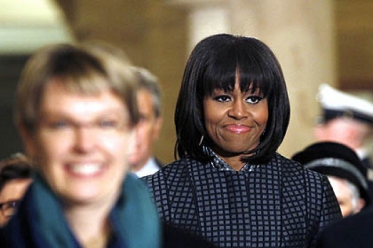 First lady Michelle Obama walks on Capitol Hill in Washington, Monday, Jan. 21, 2013, for President Barack Obama's ceremonial swearing-in ceremony during the 57th Presidential Inauguration.