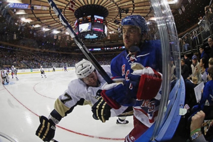 Paul Martin hits Marian Gaborik in the second period of Sunday's win against the Rangers. After a scoring change, Martin now will be credited with the season-opening goal Saturday against the Flyers that was originally given to Tyler Kennedy.