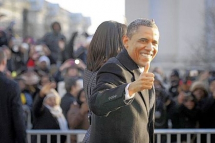President Obama gives the crowd along Pennsylvania Avenue a "thumbs up" during the inaugural parade Monday in Washington.