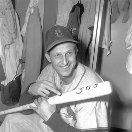 Stan Musial of the St. Louis Cardinals holds bat with which he hit his 300th major league home run in 1955.