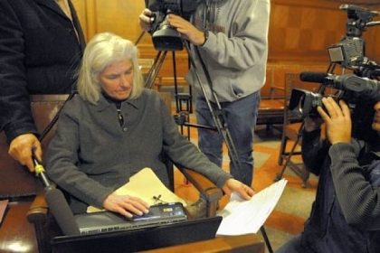 Elizabeth Pittinger, executive director of the Citizen Police Review Board, plays audio of the 911 dispatcher's call involving Ka'Sandra Wade as others listen after a meeting with three members of the board in city council's chamber.