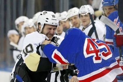 Tanner Glass gives -- and takes -- in his scrum with Arron Asham Sunday night in New York.