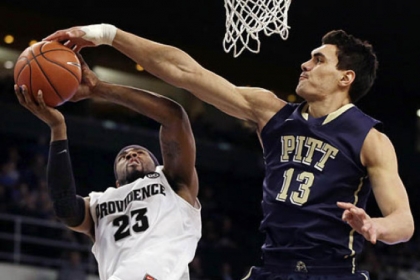 Steven Adams, right, blocks a shot by Providence's LaDontae Henton in the first half Tuesday night in Providence, R.I.