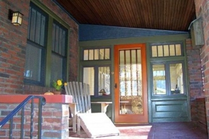 Architect Fred Fargotstein advised the owner of this bungalow in Fox Chapel to strip the white paint covering the front porch and refinish it in rich Craftsman-style stains and colors. A period light fixture now hangs from the beadboard ceiling.