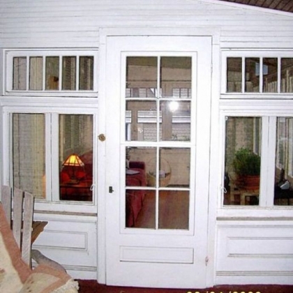 Before photo of front porch of Fox Chapel bungalow.Architect Fred Fargotstein advised the owner of this bungalow in Fox Chapel to strip the white paint covering the front porch and refinish it in rich Craftsman-style stains and colors.