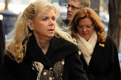 Janine Orie and suspended Supreme Court Justice Joan Orie Melvin walk toward the Allegheny County Courthouse this morning. Jury selection has started in the trial of Justice Orie Melvin.