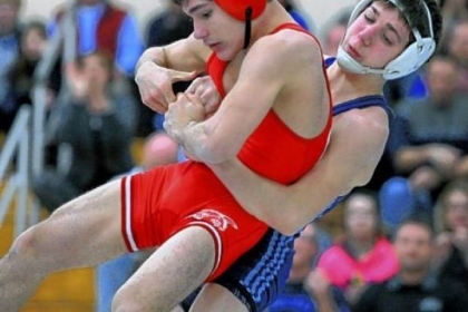 Kittanning's Evan Bowser is taken down and pinned by Burrell Damon Greenwald in the 126 lb class at the finals of the WPIAL Class AA Section 3 Wrestling tournament at South Allegheny High School.