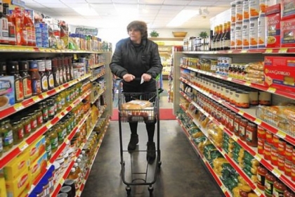 Debbie Bozek of Hunker shops at the Youngwood Corner Market. The market is close to her home, saving her from traveling to Greensburg or elsewhere to grocery shop. She walks with the aid of a cane and likes the help she receives from the store's staff.